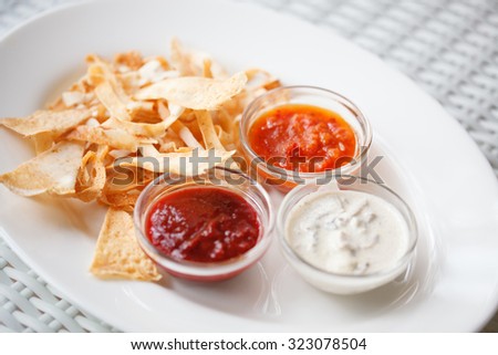 Tortilla nachos chips with three super bowl dips