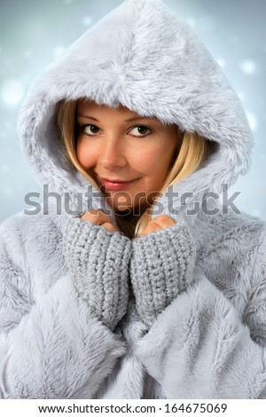 Winter Beauty. Studio shot of model wearing winter coat.