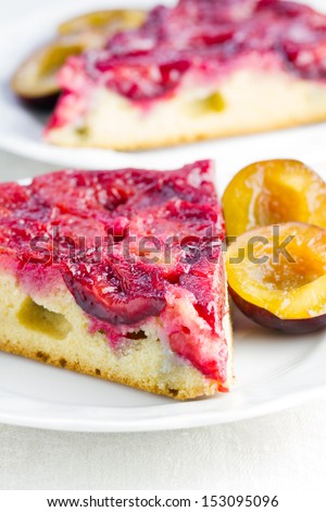 Slice of homemade plum cake on plate