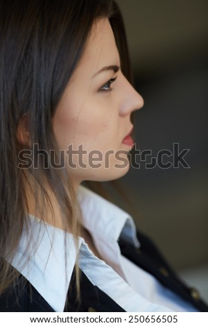 Young business woman in profile