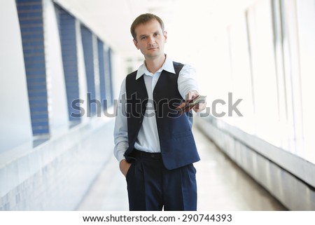 man holding a purse with money