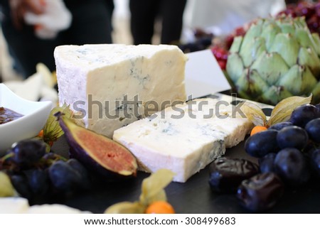 set of ingredients: cheese, olives, berries, sauces, snacks