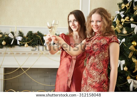 two beautiful girls on New Year's party with champagne