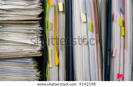 Many colorful papers of documents to organize