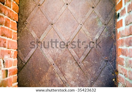Rusty metal frame with red antique brick edges