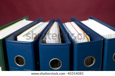 There is documents and catalogs on red background