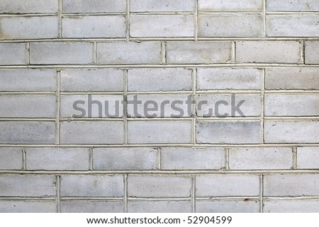 It is a grey stone wall, background of architecture
