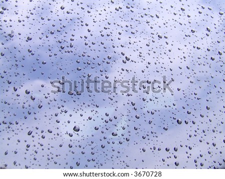 Water droplets on sky background.