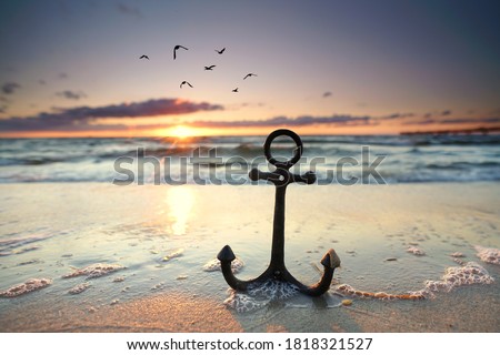 anchor at the beach with sunset light