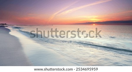 Similar – Image, Stock Photo sunset over the baltic sea, portrait of a young woman standing on the beach