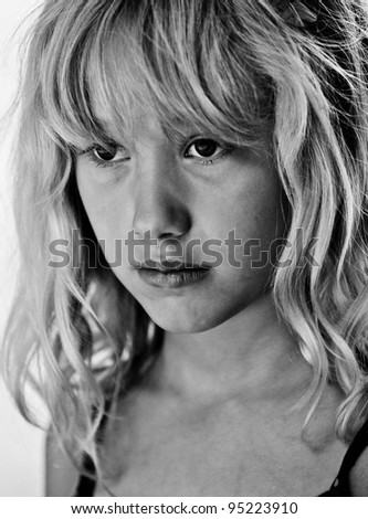 young white female looking sad in black and white