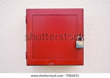 locked red box on a white wall