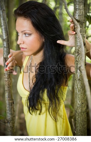 portrait of beautiful woman seeking for the right thing in nature