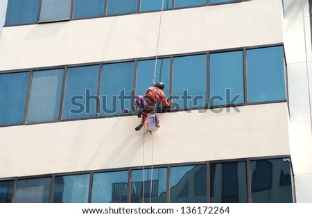 Workers cleaning Business Building in Center Business Area, Bangkok