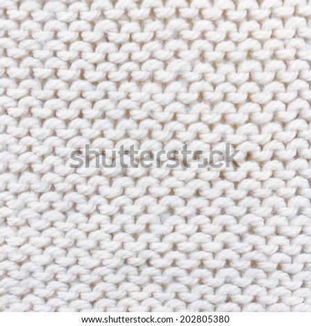 white knitted background. texture knitted.  handmade work.