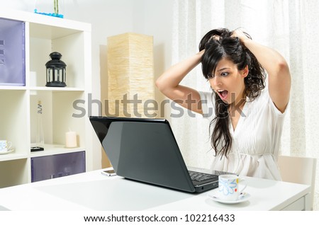 Computer mistake woman.  Homeworking caucasian student in trouble because of laptop problem.