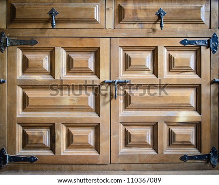 Wooden doors of an old cupboard