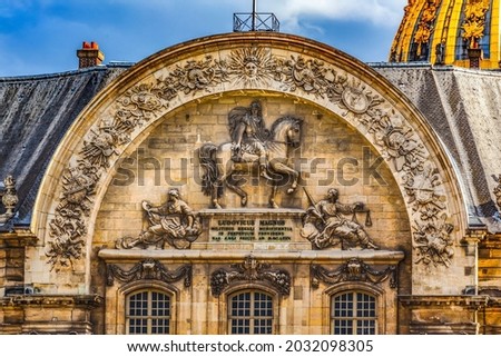 North Portal Gate Les Invalides Paris France.  King Louis IV created Invalides 1600s. Sun symbol of King Louis Large military muesum with tombs military figures, including Napoleon Photo stock © 