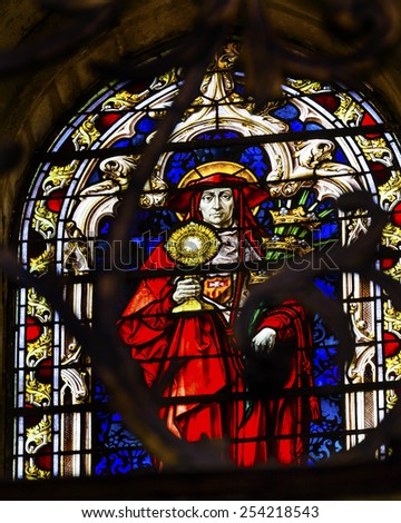 SALAMANCA, SPAIN - MAY 10, 2014 Red Catholic Cardinal Stained Glass in New Salamanca Cathedral Castile Spain. New Cathedral was built from 1513 to 1733.