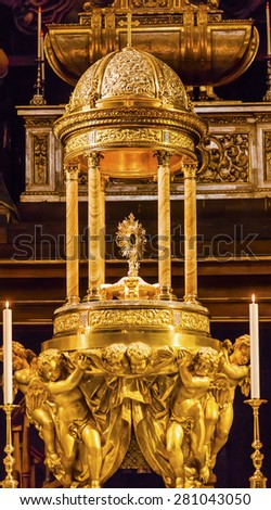 MADRID, SPAIN - MAY 8, 2014 Golden Baptismal Font Basilica Santa Iglesia Collegiata de San Isidro Madrid Spain. Named after Patron Saint of Madrid, Saint Isidore, Church was created in 1651