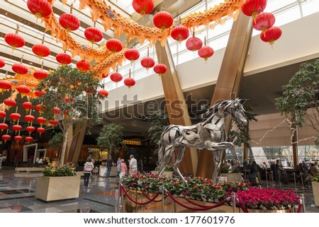 LAS VEGAS - FEBRUARY 15, 2014: A large metal horse sculpture is the main attraction in the Aria\'s lobby during the year of the horse celebrations 2014.
