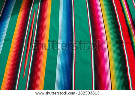 Typical traditional colorful Mexican festive fabric cloth on display