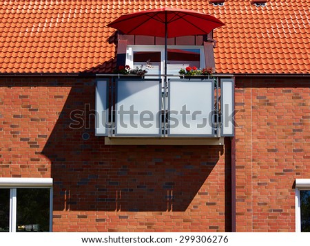 Red sunshade parasol on a modern balcony perfect summer background image
