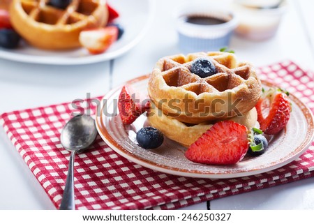 waffles with strawberry and blueberry and caramel sauce