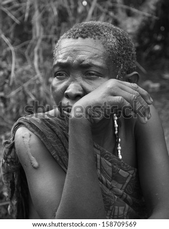 LAKE EYASI,ARUSHA/TANZANIA-CIRCA FEBRUARY 2012: portrait of unidentified member of the Hadza tribe circa Feb 2012 in Lake Eyasi. The Hadza are the last hunter-gatherers, clic-speakers of Tanzania.