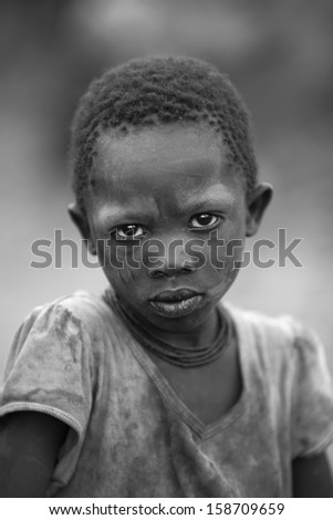 LAKE EYASI,ARUSHA/TANZANIA-CIRCA FEBRUARY 2012: portrait of unidentified child of the Hadza tribe circa Feb 2012 in Lake Eyasi. The Hadza are the last hunter-gatherers, clic-speakers of Tanzania.