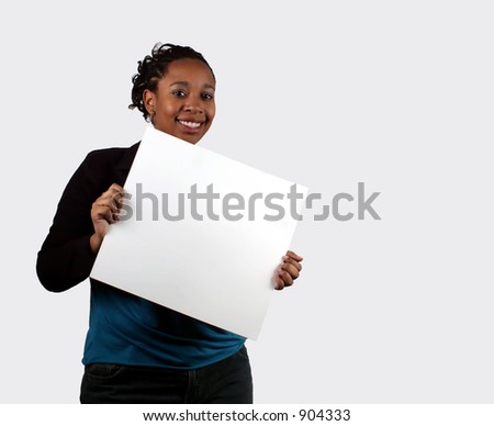 A young woman holding a blank sign.