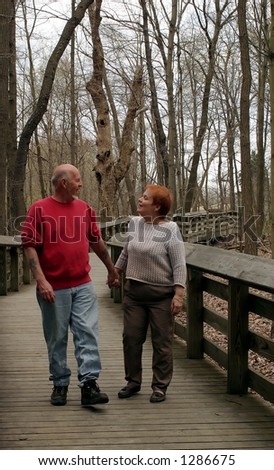A mature couple talking and taking a walk.