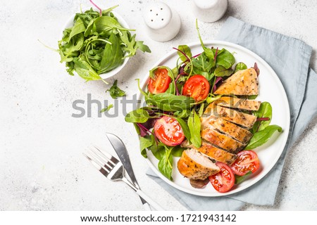 Chicken fillet with salad. Healthy food, keto diet, diet lunch concept. Top view on white background. Stock foto © 