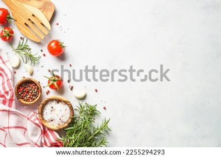 Food background with spices, herbs and utensil on white background. Foto d'archivio © 