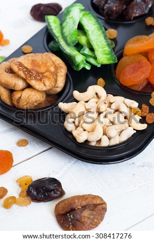 Dried fruits in the form of cakes - dried apricots, dates, figs, papaya, raisins and cashews