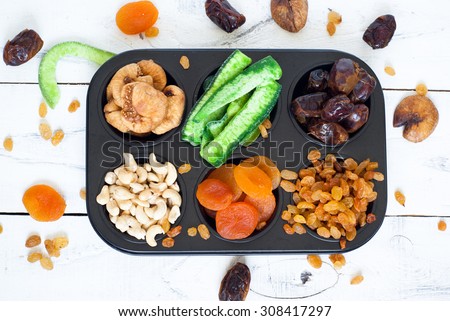 Dried fruits in the form of cakes - dried apricots, dates, figs, papaya, raisins and cashews