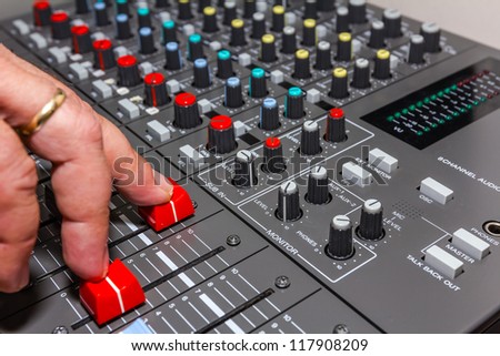 DJ is take control sound on recording or broadcasting programs in the studio