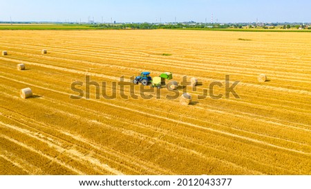 Similar – Image, Stock Photo Packed bales of straw on a meadow