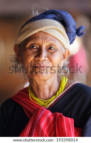 BAM MUANG PAM, THAILAND, NOVEMBER 22 : close portrait of an old Karen tribe woman, Thai ethnicity, in the village of  Bam Muang Pam, north Thailand on November 22, 2012