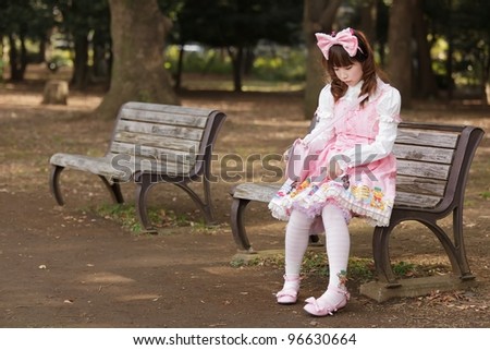 sad japanese fashion sitting on bench, Tokyo
