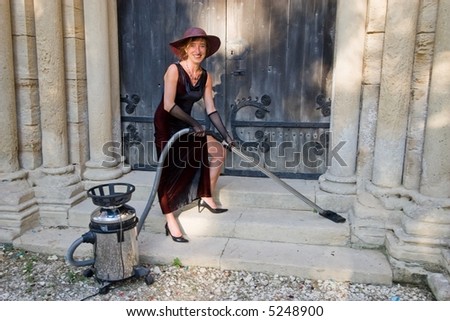 woman smiling while cleaning church stairs with hoover