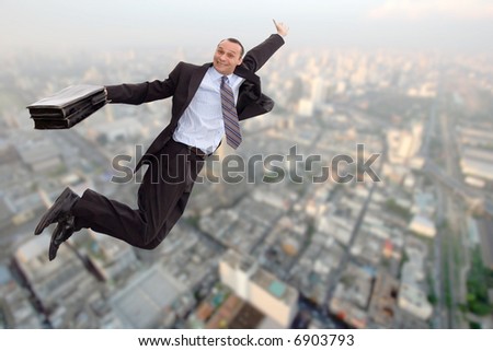 stock-photo-smiling-business-man-flying-over-a-big-city-6903793.jpg