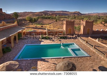 turquoise pool in tranquil moroccan hotel, ait benhaddou, morocco