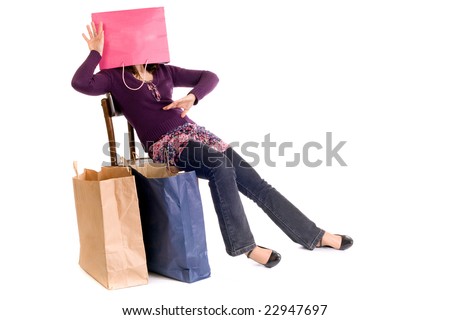 seated woman with head inside shopping bag