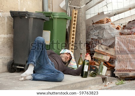 Poor And Drunk Man Lying On Sidewalk With Bottles Of Wine Near Trash ...