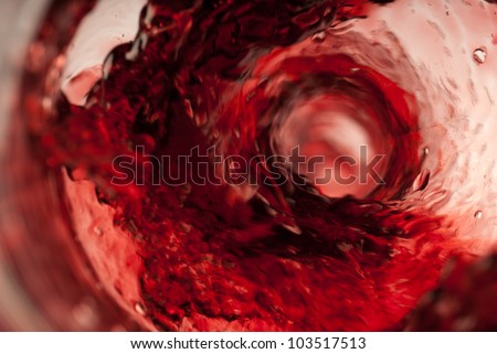 Pouring red wine insider shot in the bottle