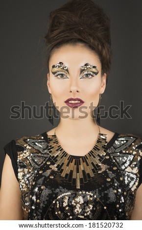 High fashion glamour model with gold make up