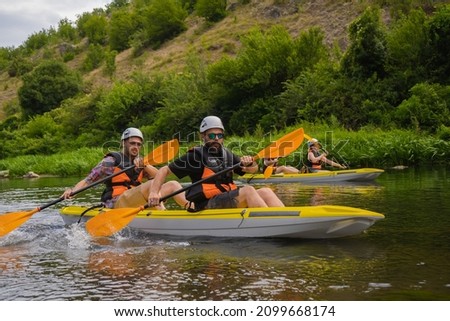 Pairs of friends are kyaking together while having a great time together Stok fotoğraf © 