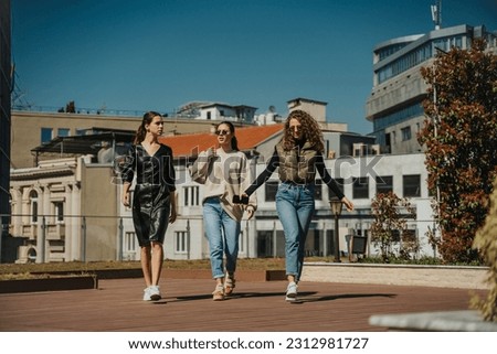 Similar – Image, Stock Photo Cheerful women dancing while listening to music
