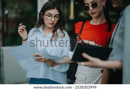 Similar – Image, Stock Photo Businesswoman making notes during workday at home